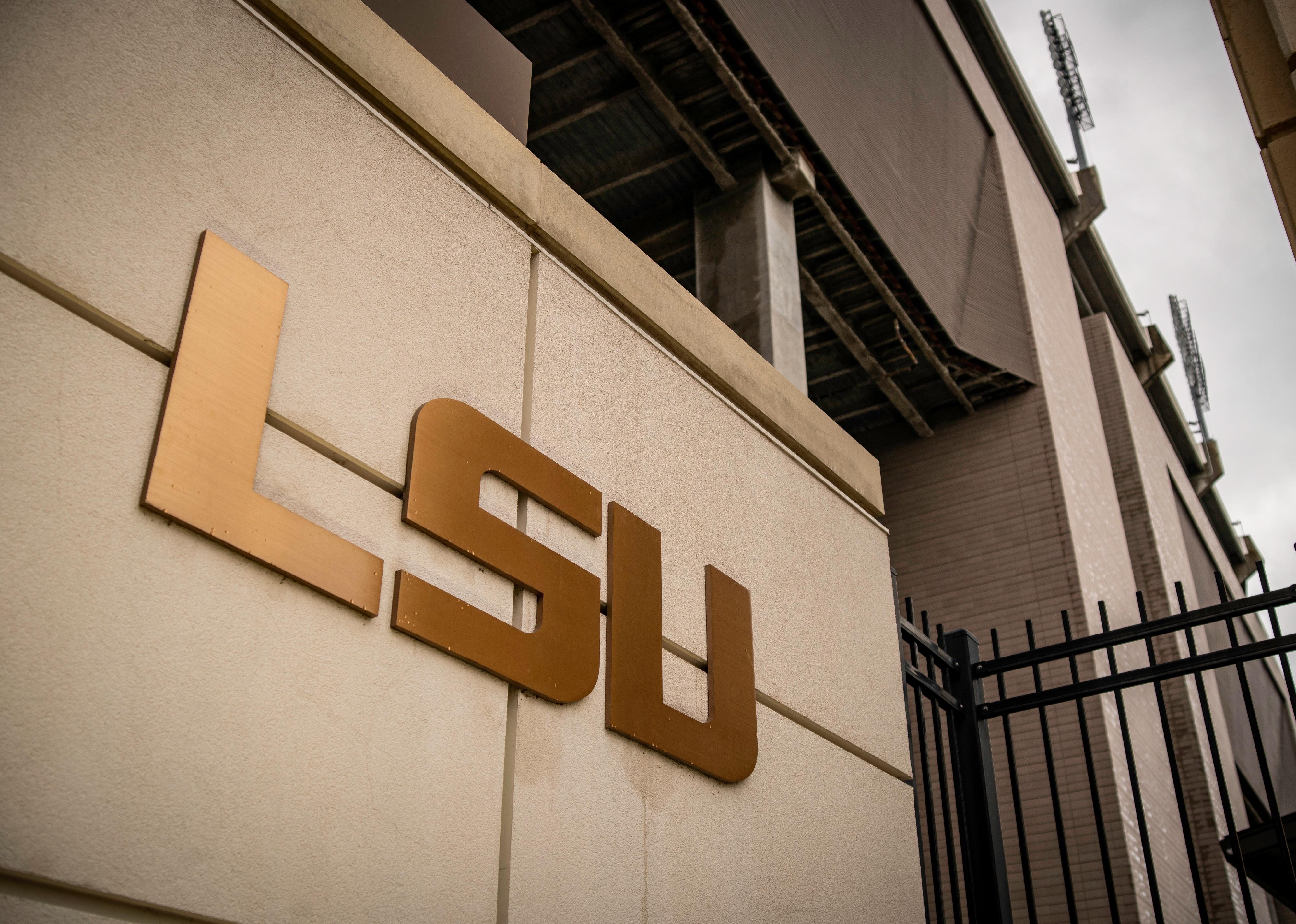 LSU (Louisiana State University) golden letters on a sign.