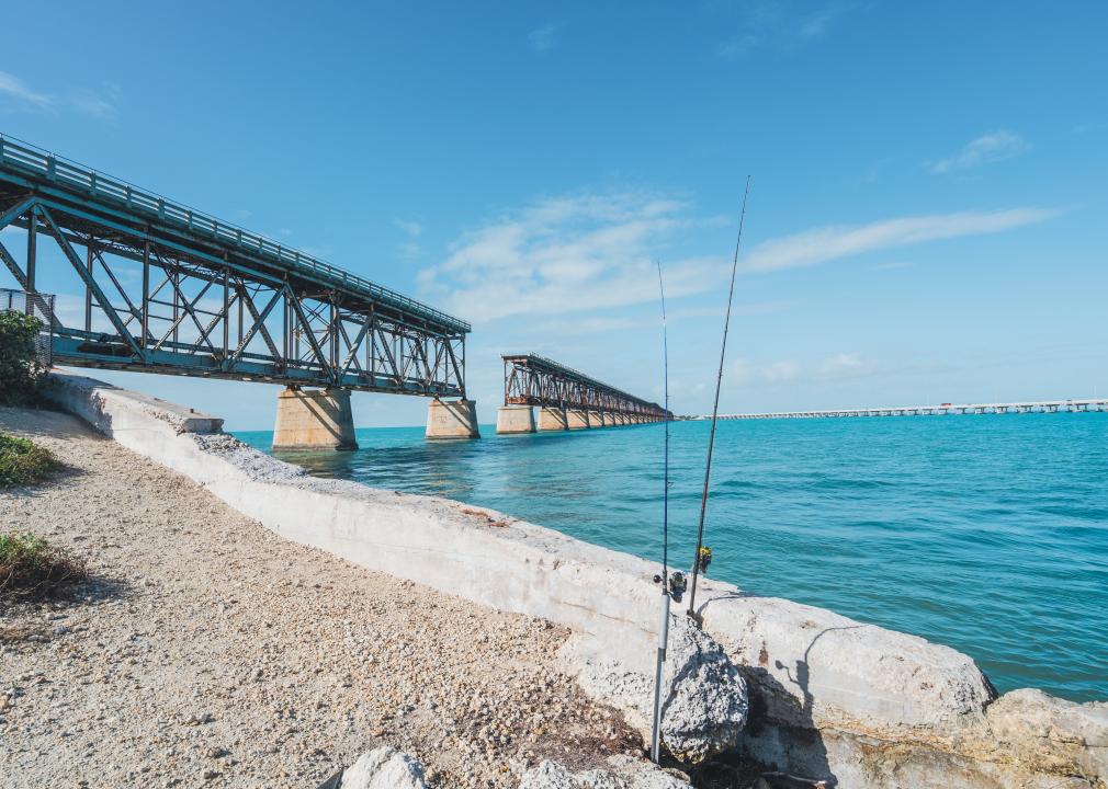 Fishing poles in front of old overseas highway bridge.