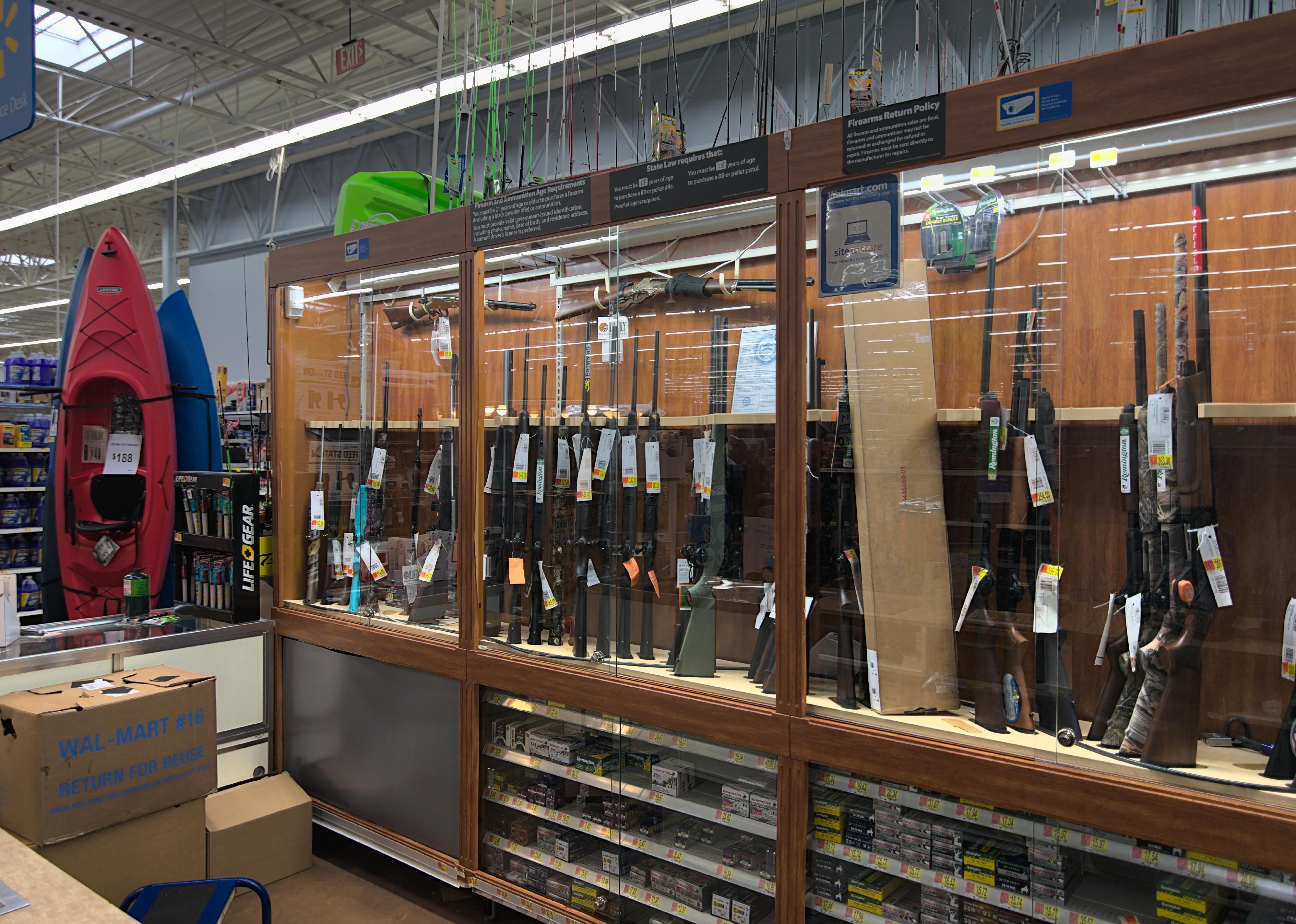 The gun case in the sporting goods department of a Walmart.