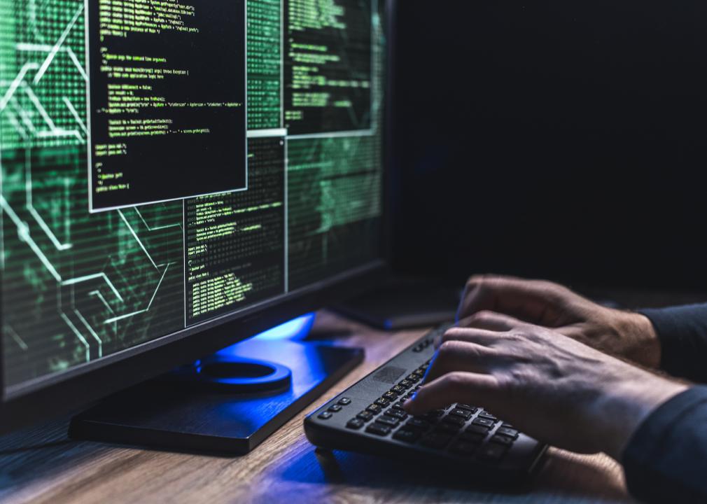 Close-up of Caucasian man hands typing data on a keyboard