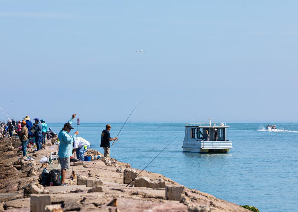 Small fishing boat navigating the Brazos Santiago Pass.