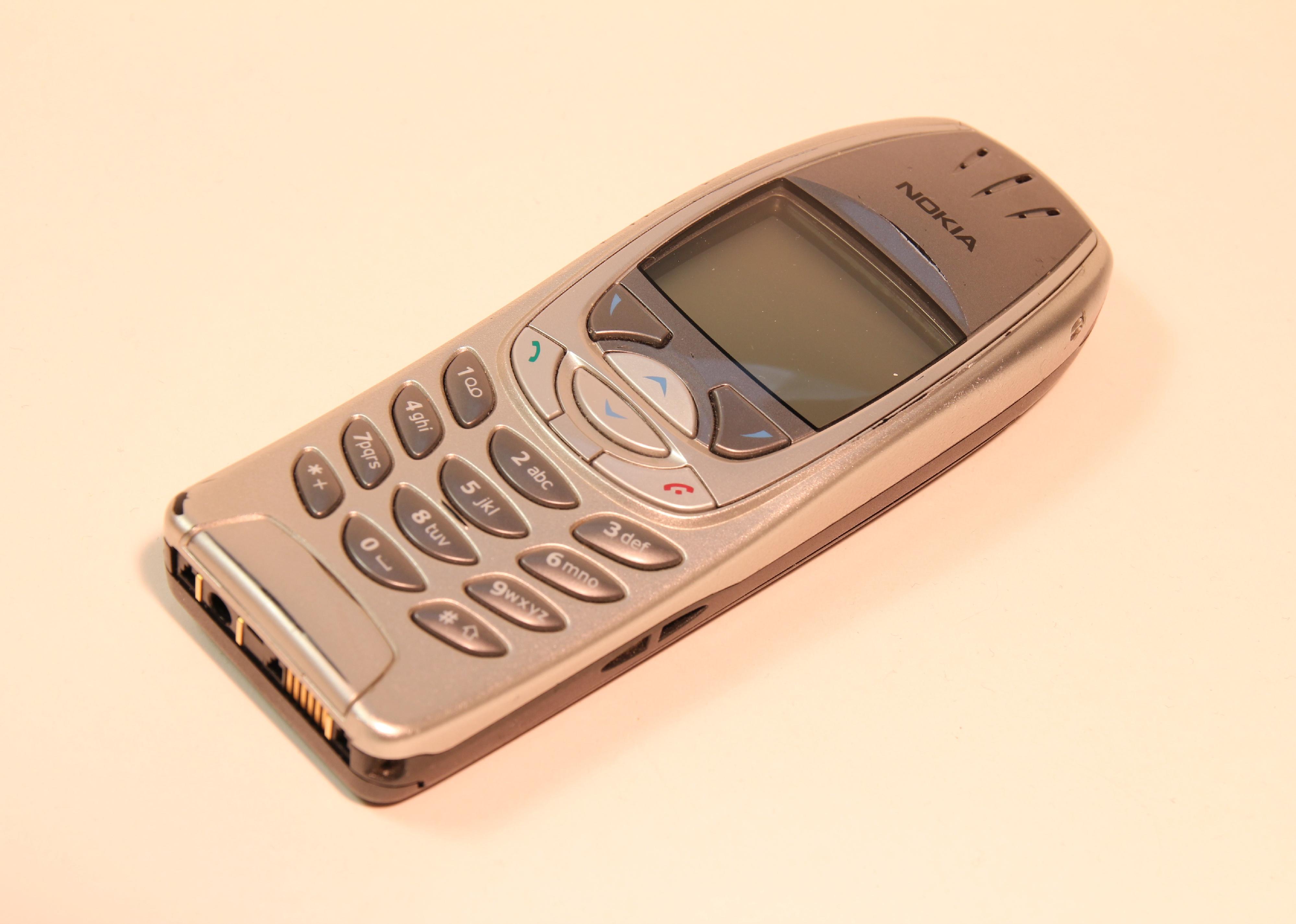 Vintage cellphone on table.