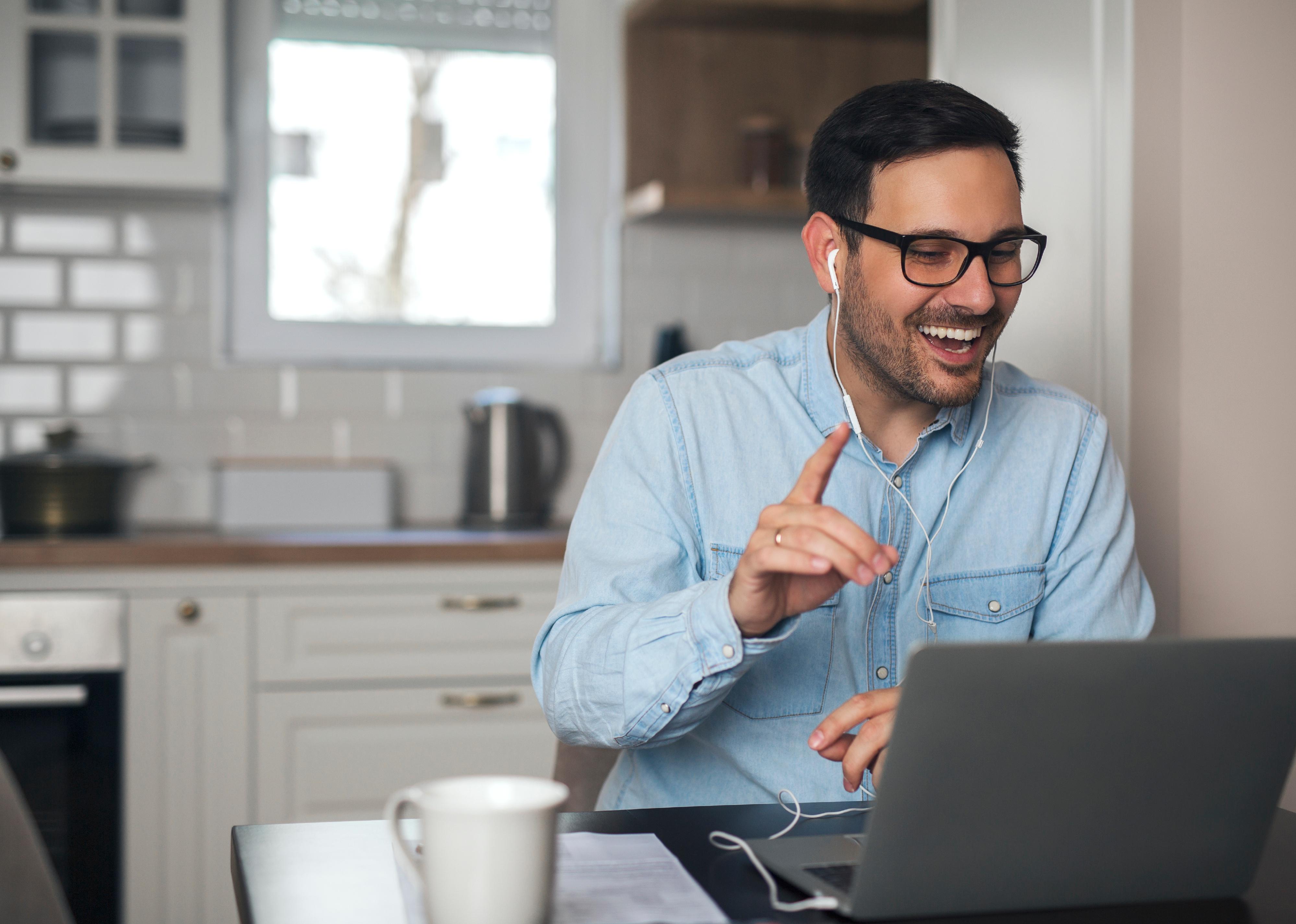 A young man on a meeting on a laptop