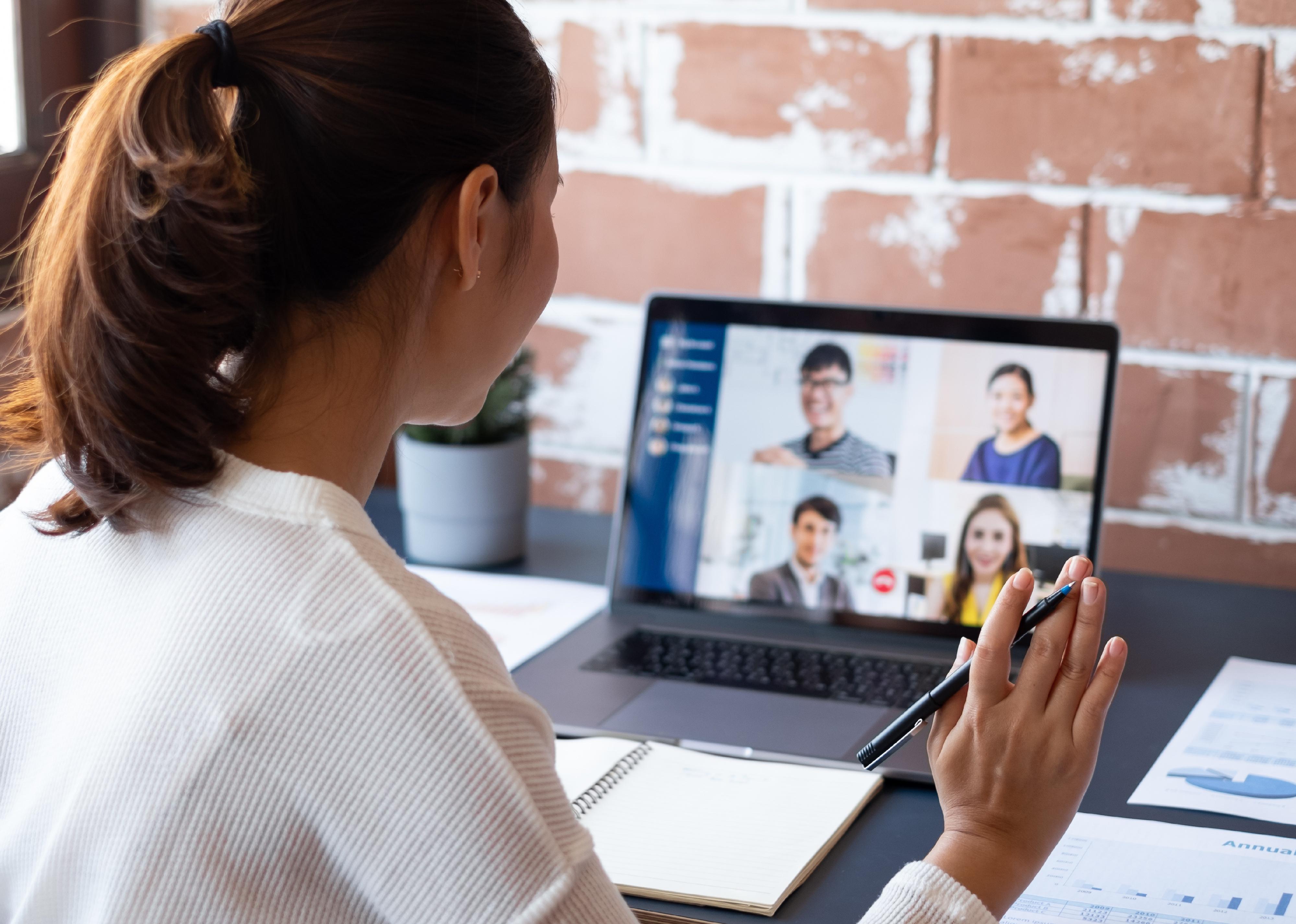 Young businesswoman at home on a virtual video meeting.