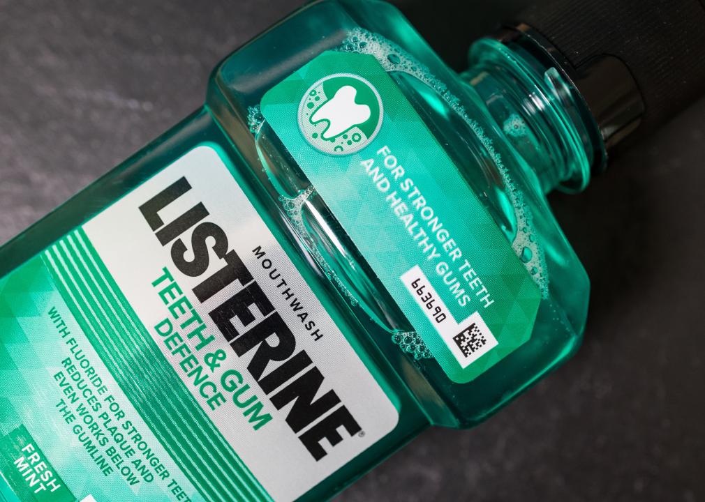 Listerine mouthwash in green plastic bottle.