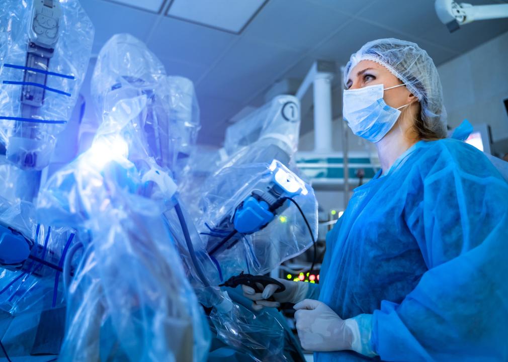 Surgeon using a modern robotic surgical system. 