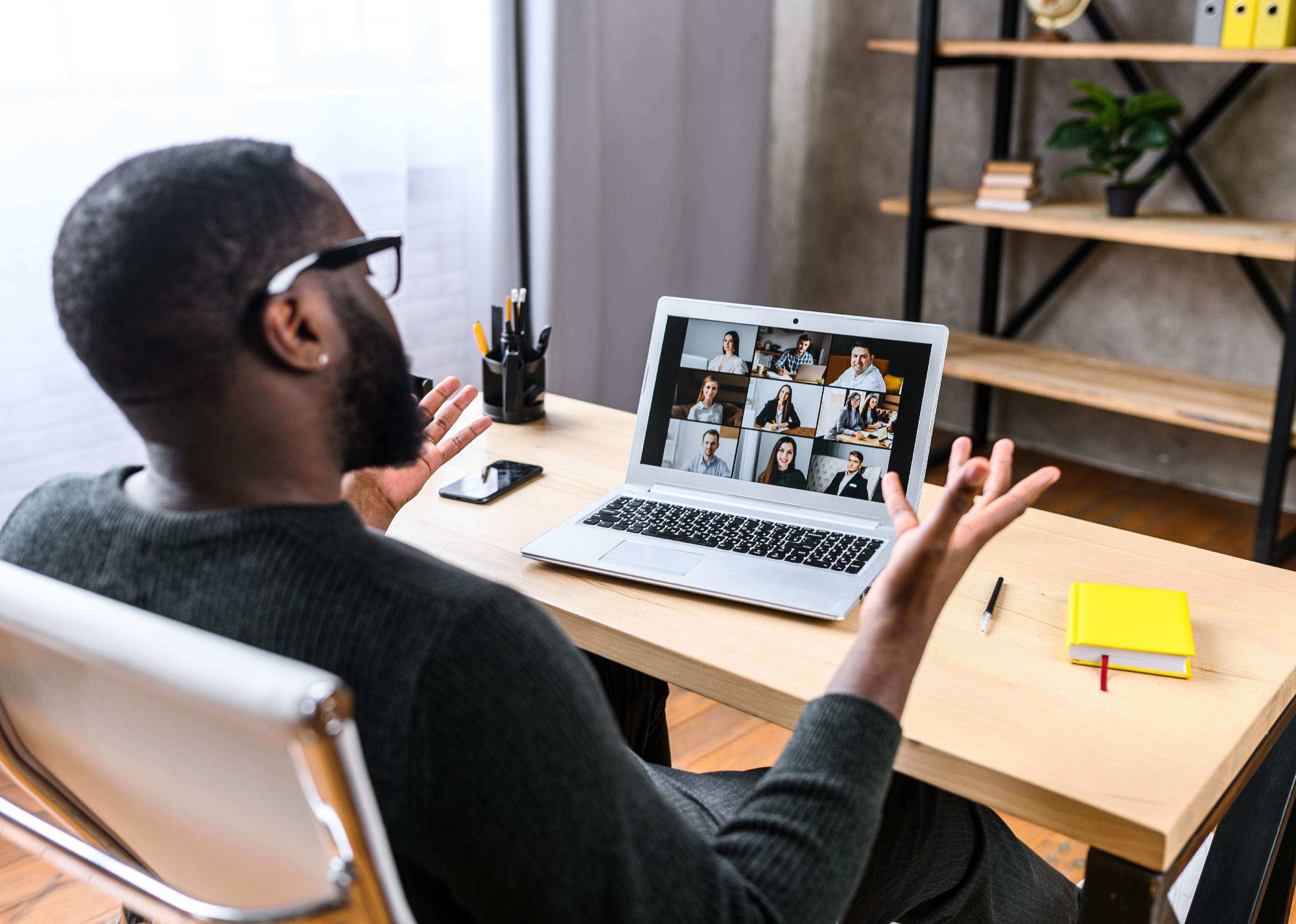 Back view of man on video call