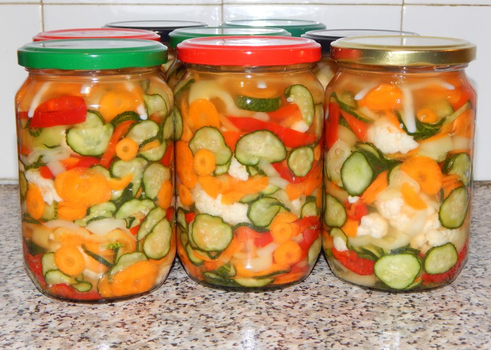 Colorful jars of pickled vegetables.