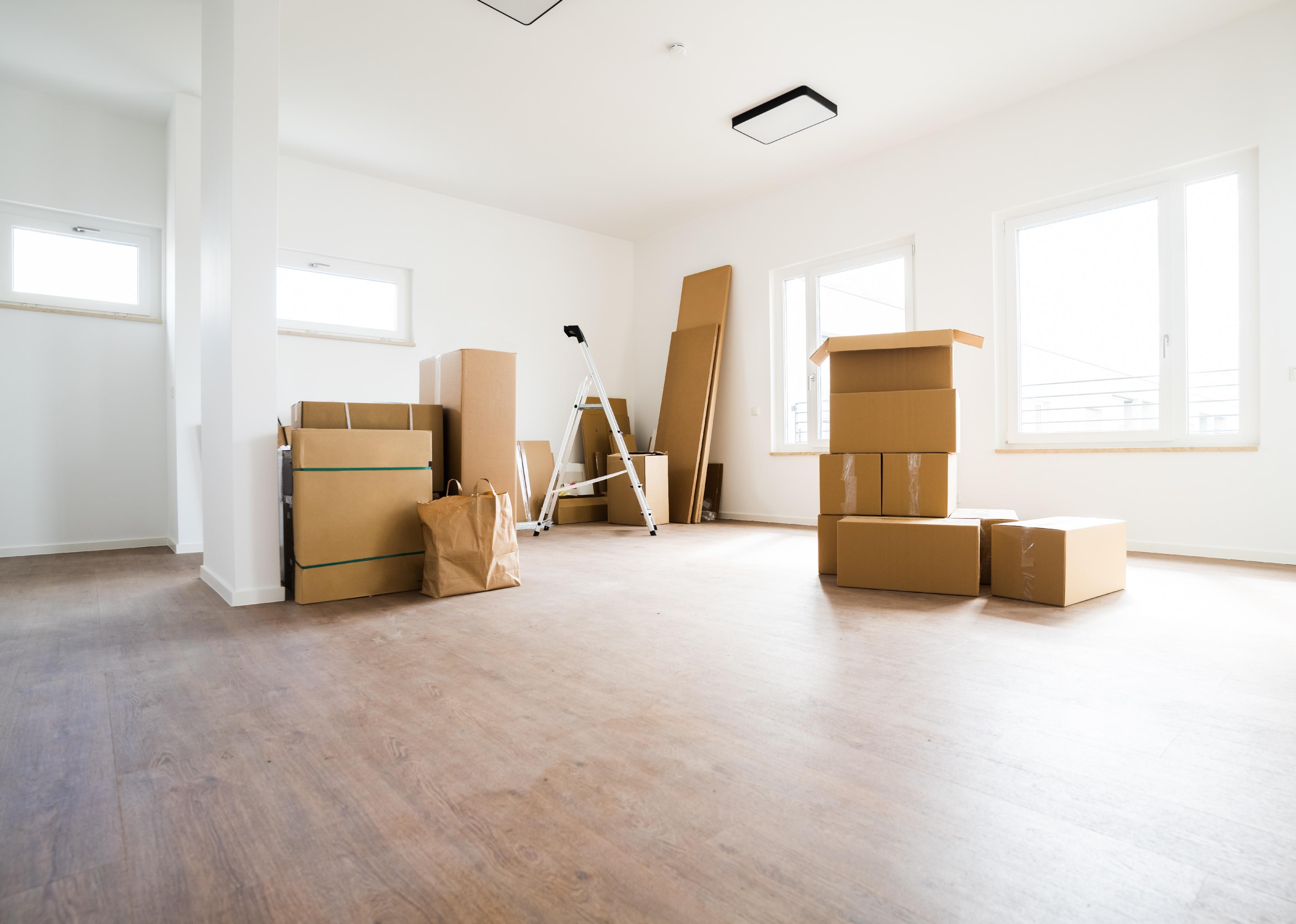 Empty room with moving boxes.