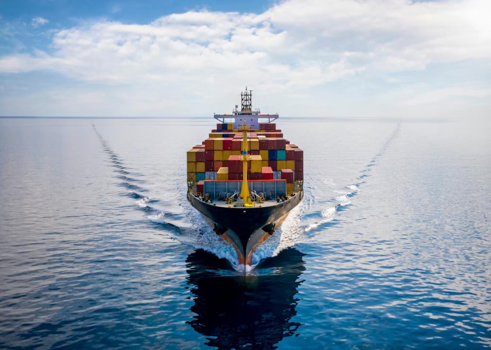 Aerial front view of a loaded container cargo vessel