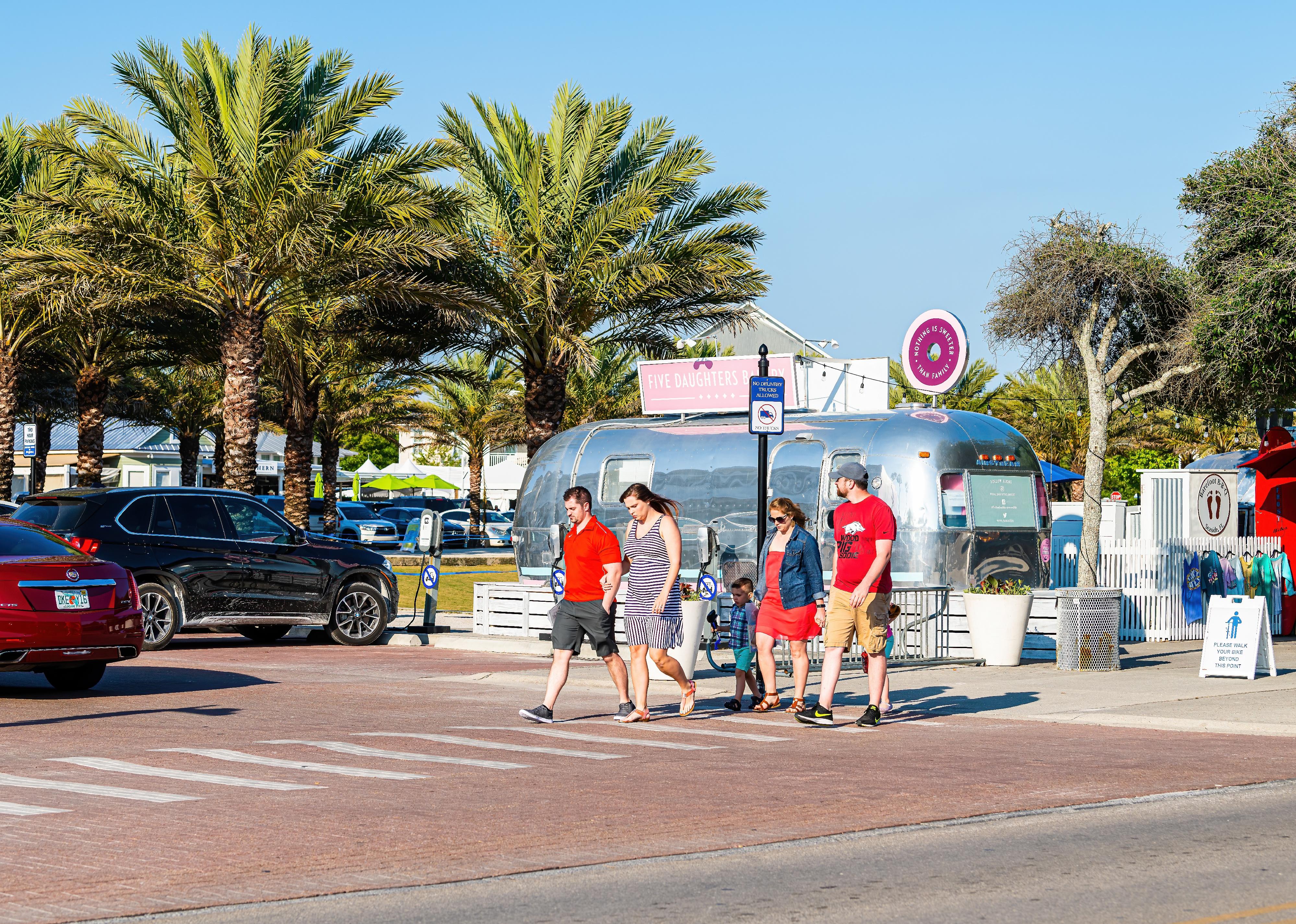 Beach town with people crossing street