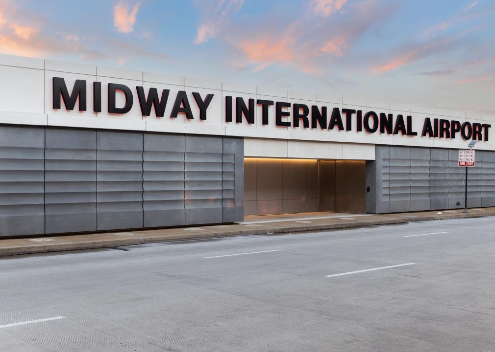 The exterior of the Midway International Airport sign during sunset.