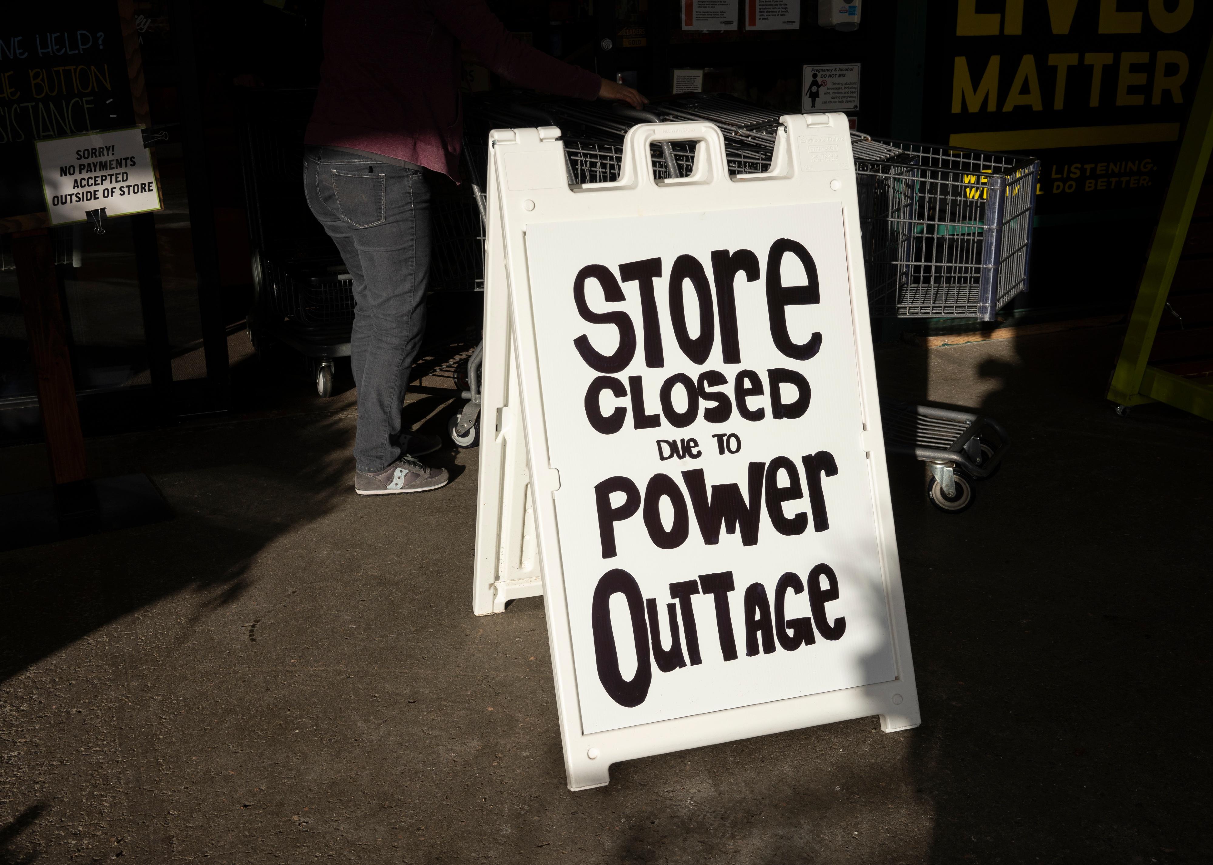 Store Closed due to Power Outage signage.