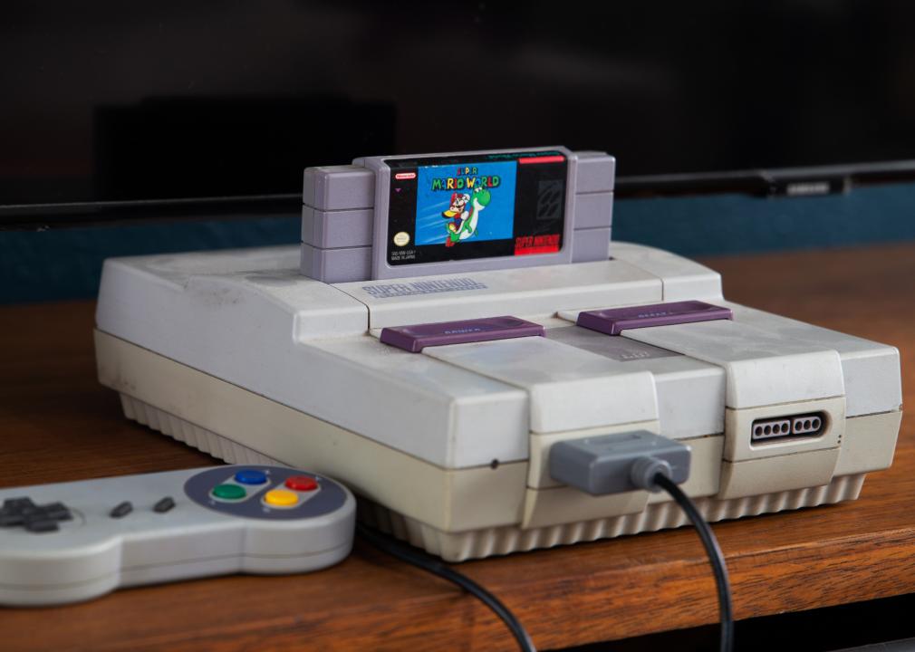Super Nintendo with control and television in the background.