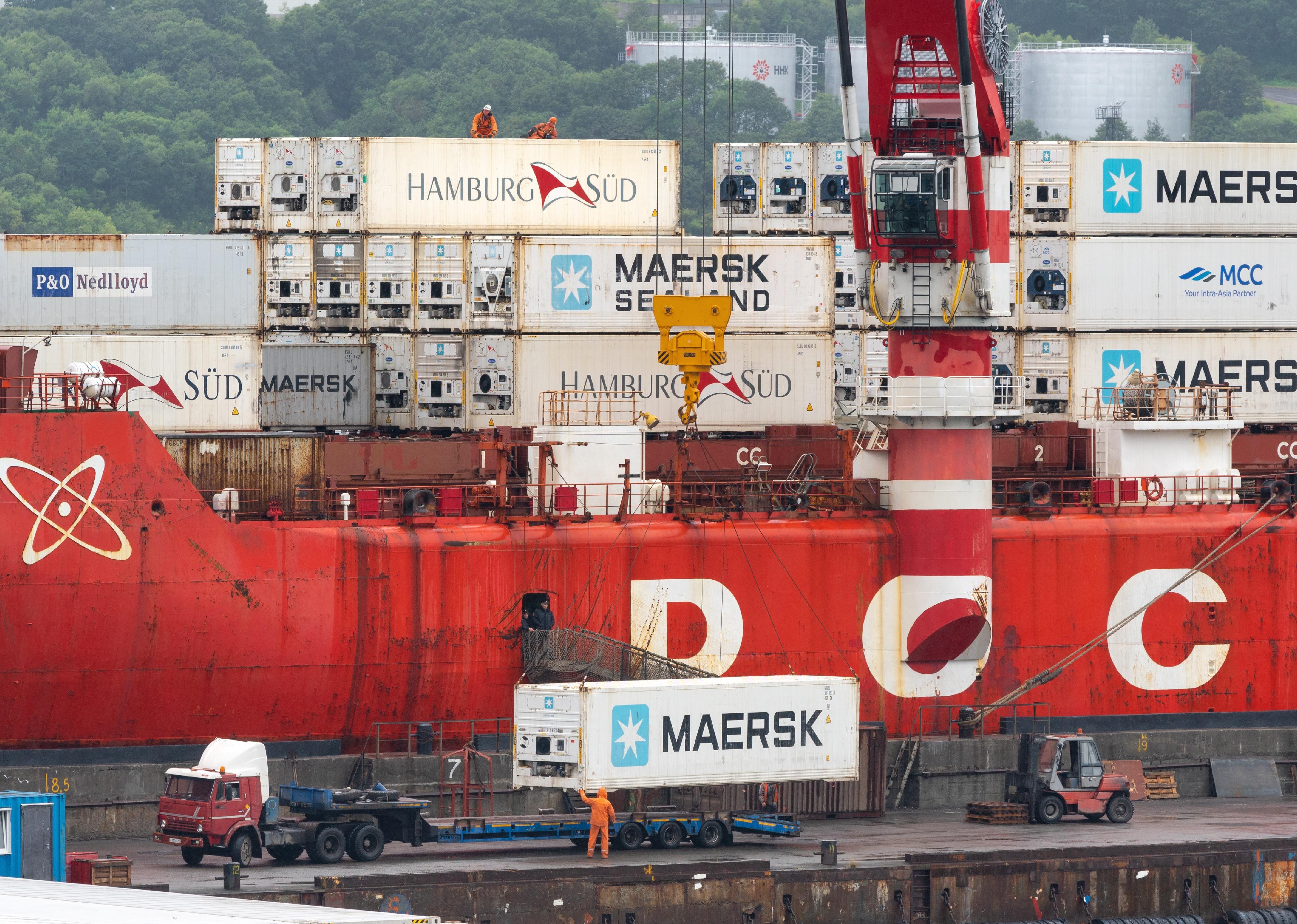 Crane unloading a container cargo ship.