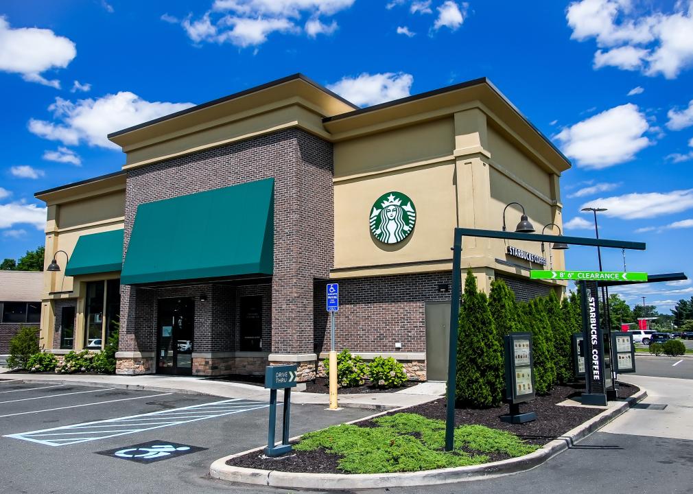 Standalone Starbucks Coffee building on a summer day.