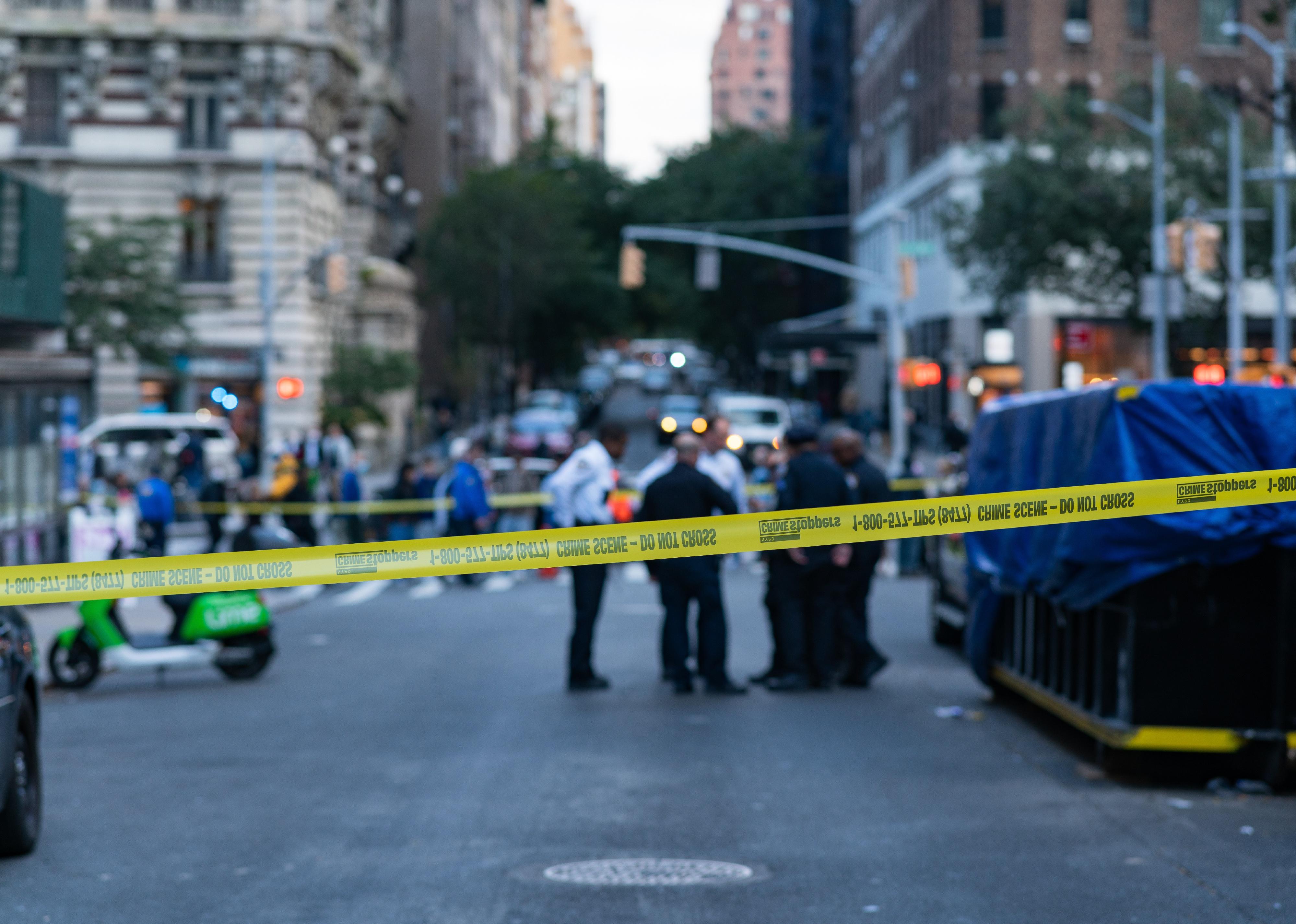 Police at the scene where a person was shot on Manhattan