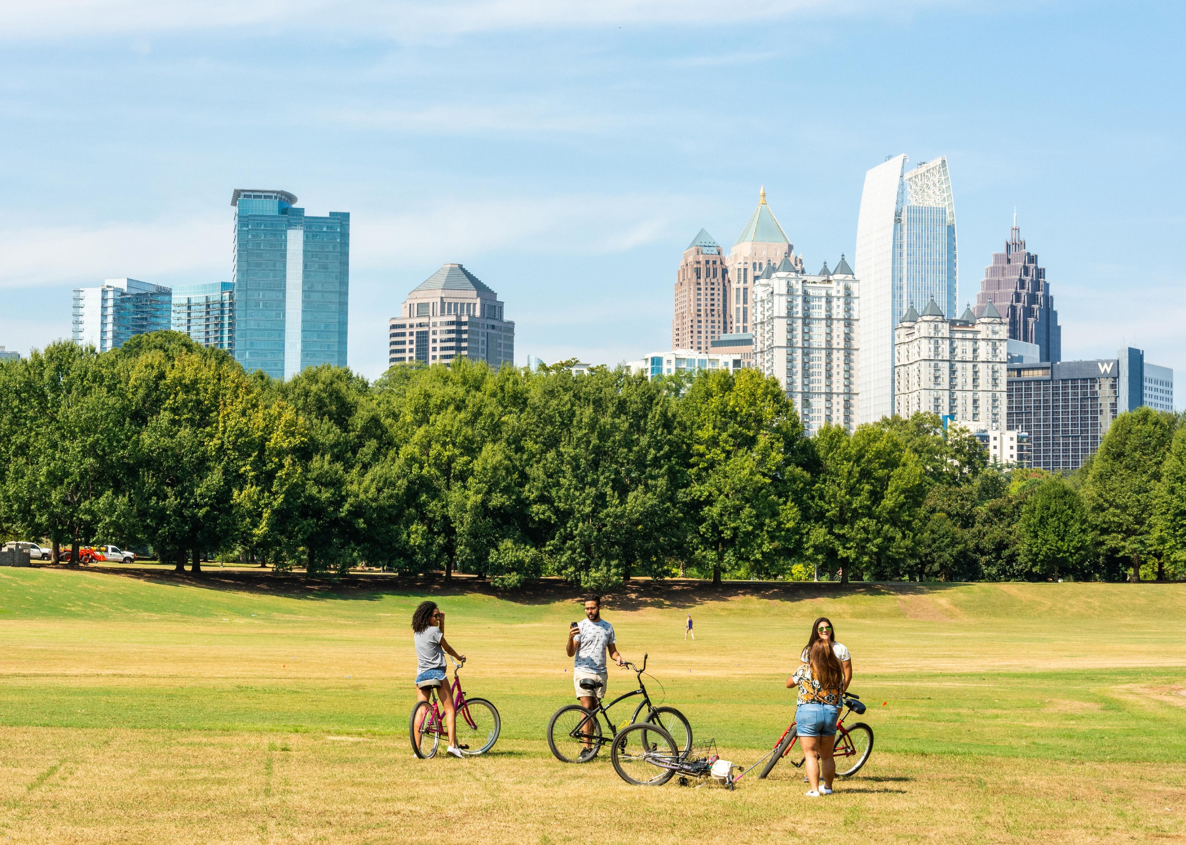 View of the the Midtown Skyline in Atlanta, GA with people and bikes in the foreground