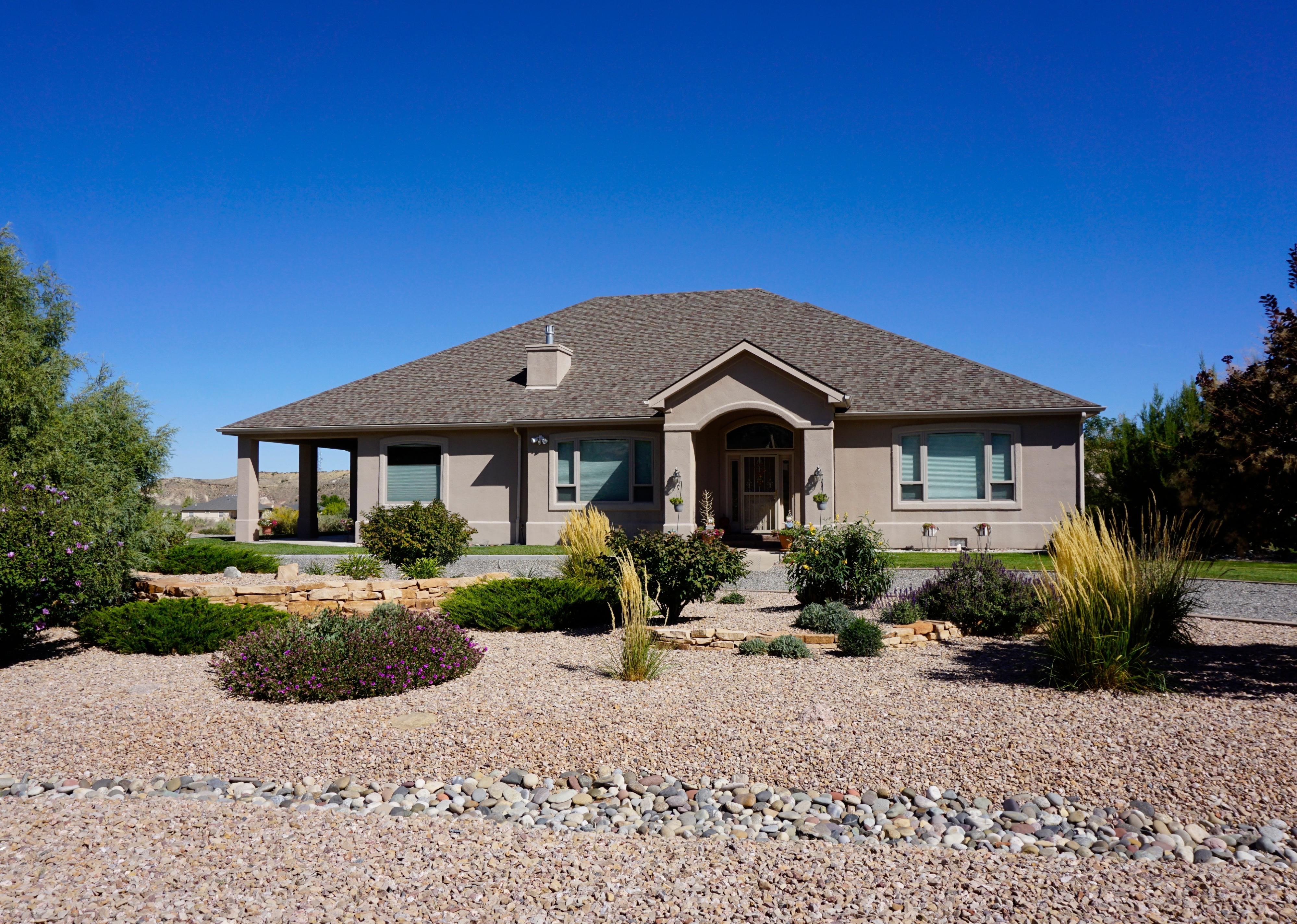 Suburban house in Colorado neighborhood with xeriscape landscaping.