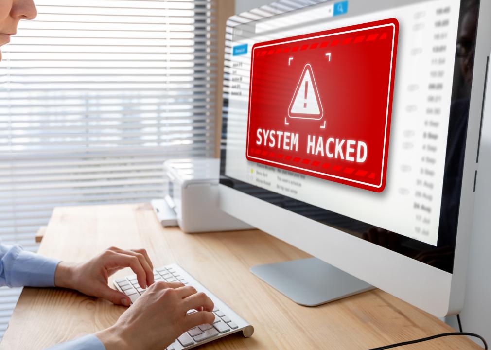 System hacked alert after cyberattack on computer network.