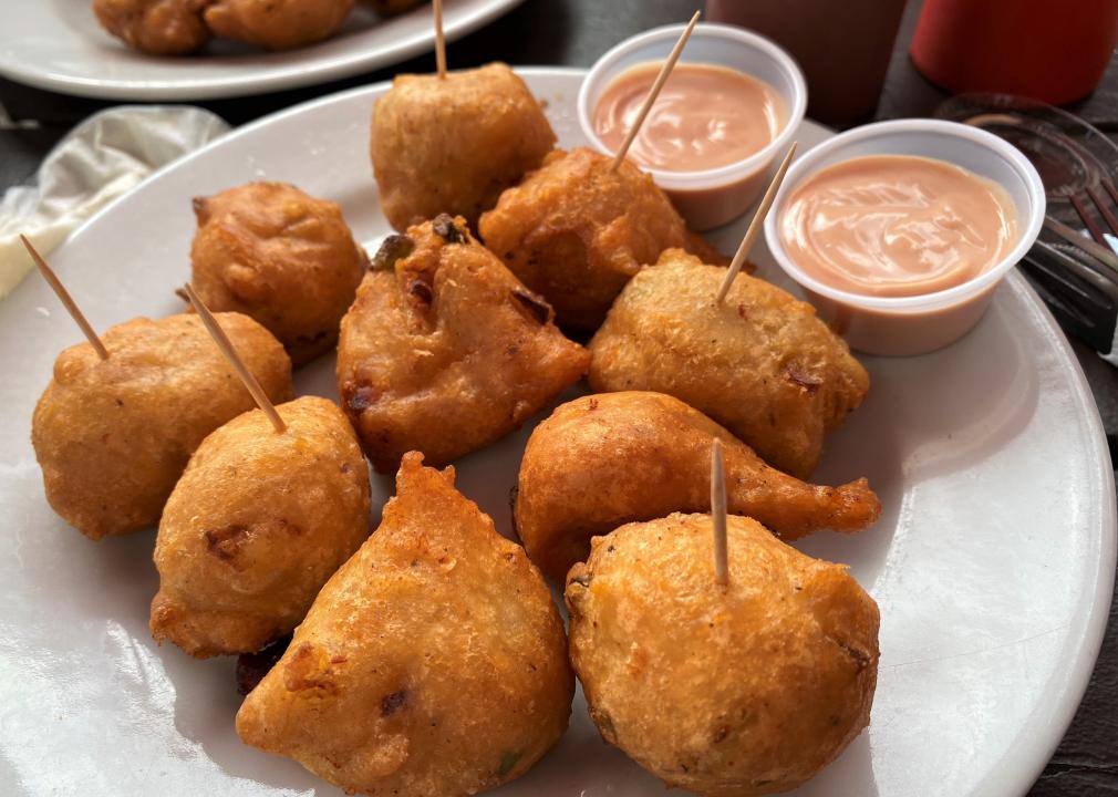 Conch Fritters with Hot Sauce.