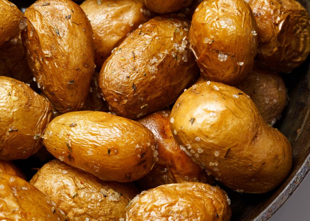 Roasted potatoes in a frying pan closeup.