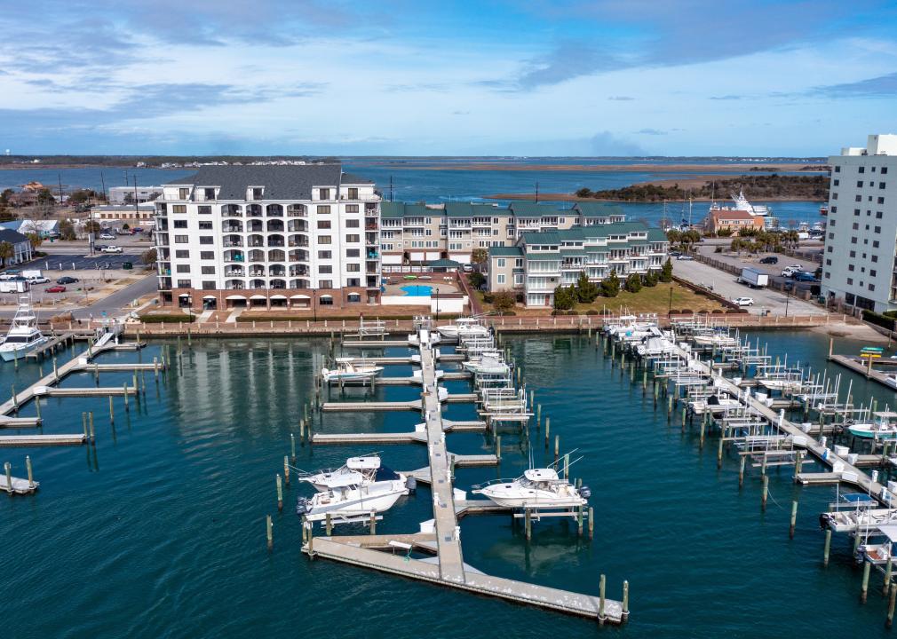 Aerial view of condos and a marina with boats in Morehead City.