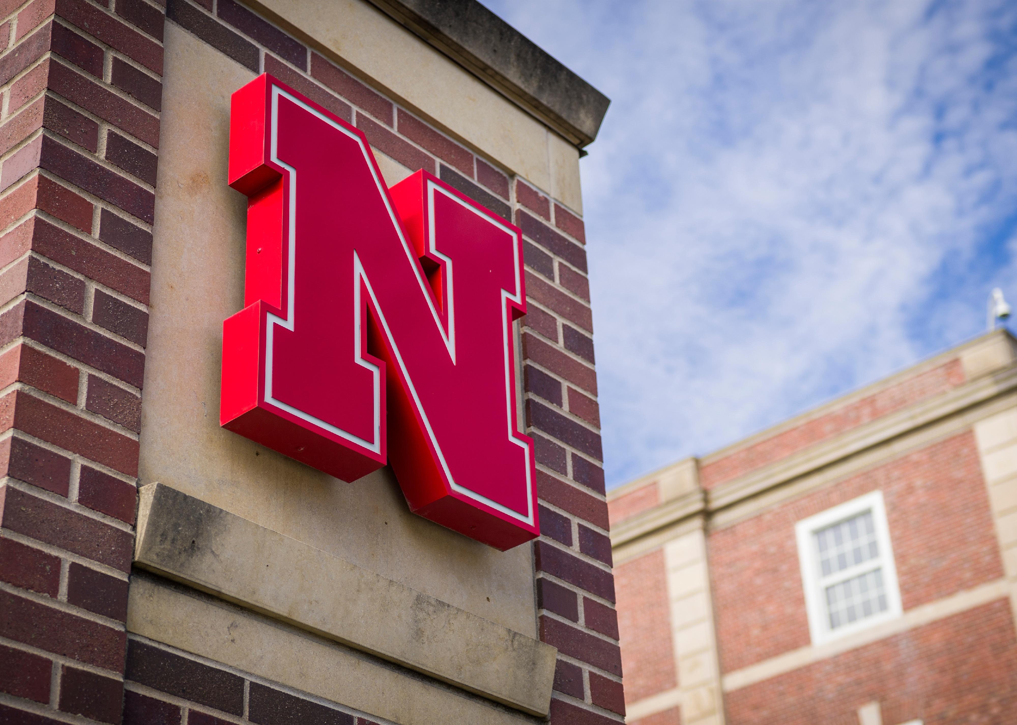 Nebraska university logo on campus building.