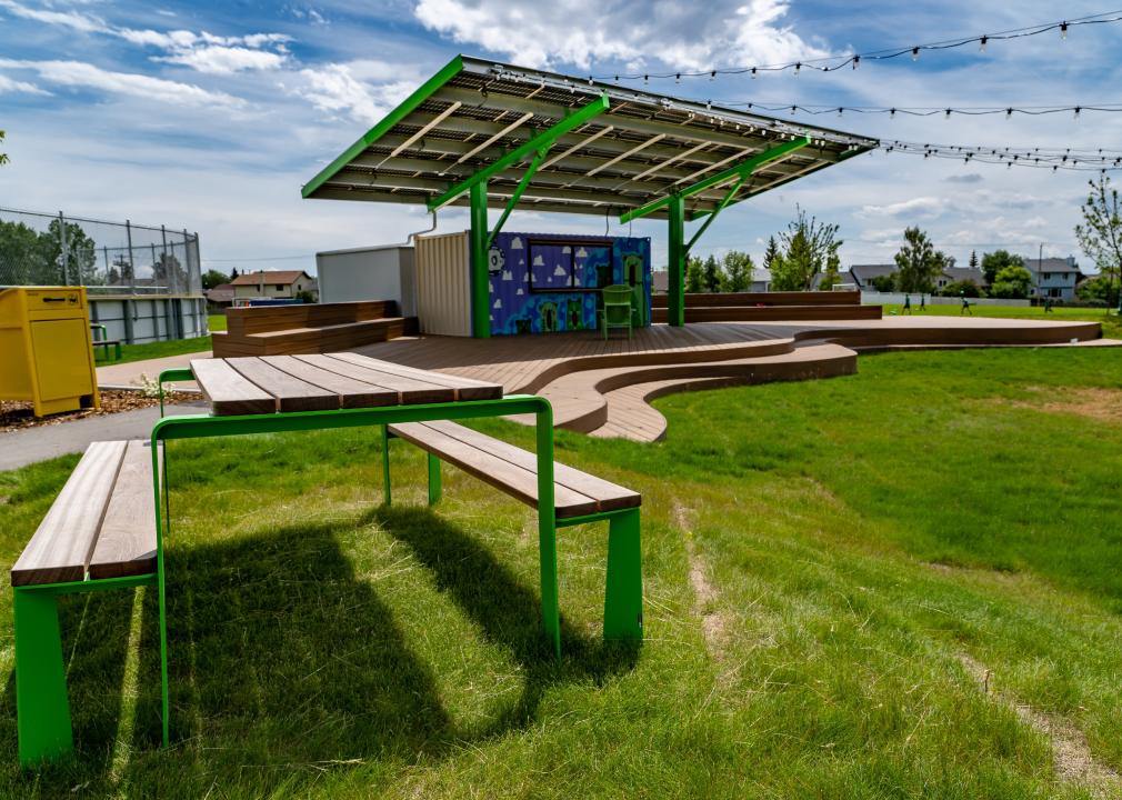 Solar rooftop amphitheater with composite decking and picnic tables at a public park