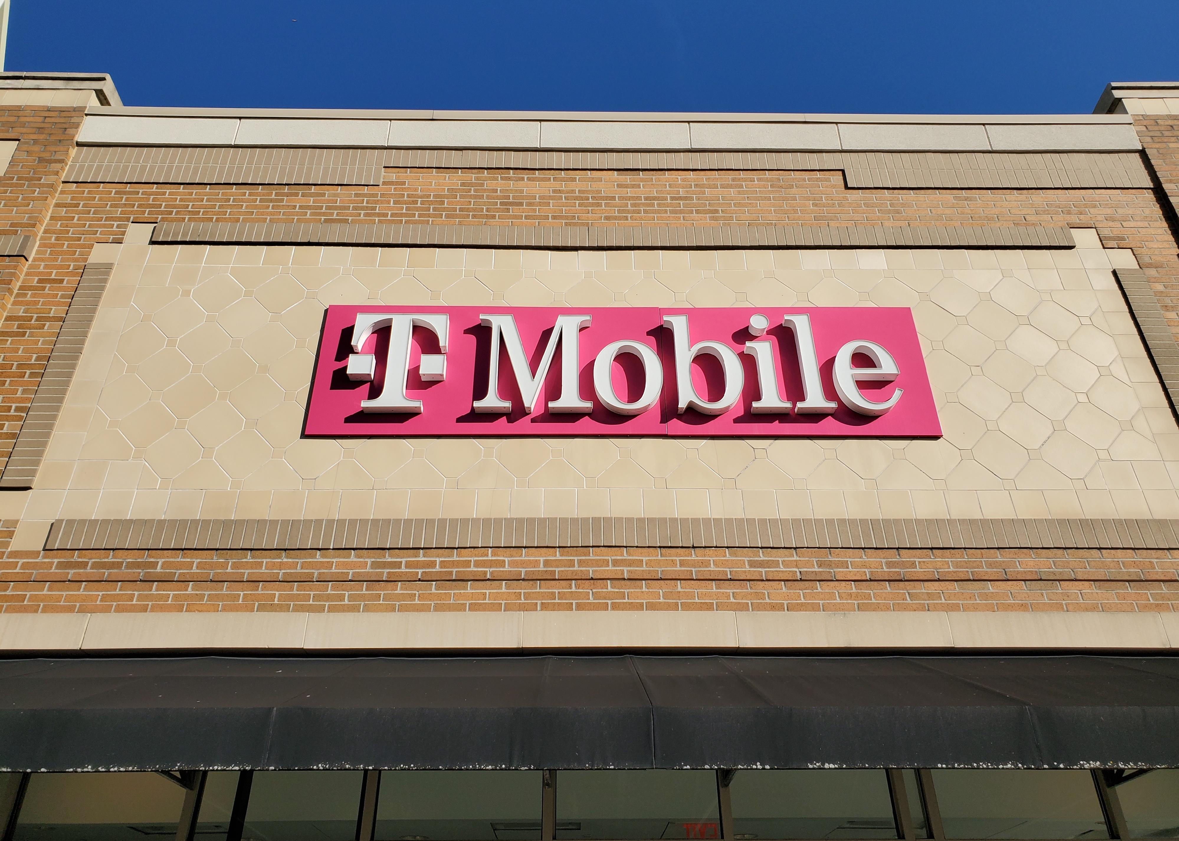 Sign for T-Mobile on outside of building.