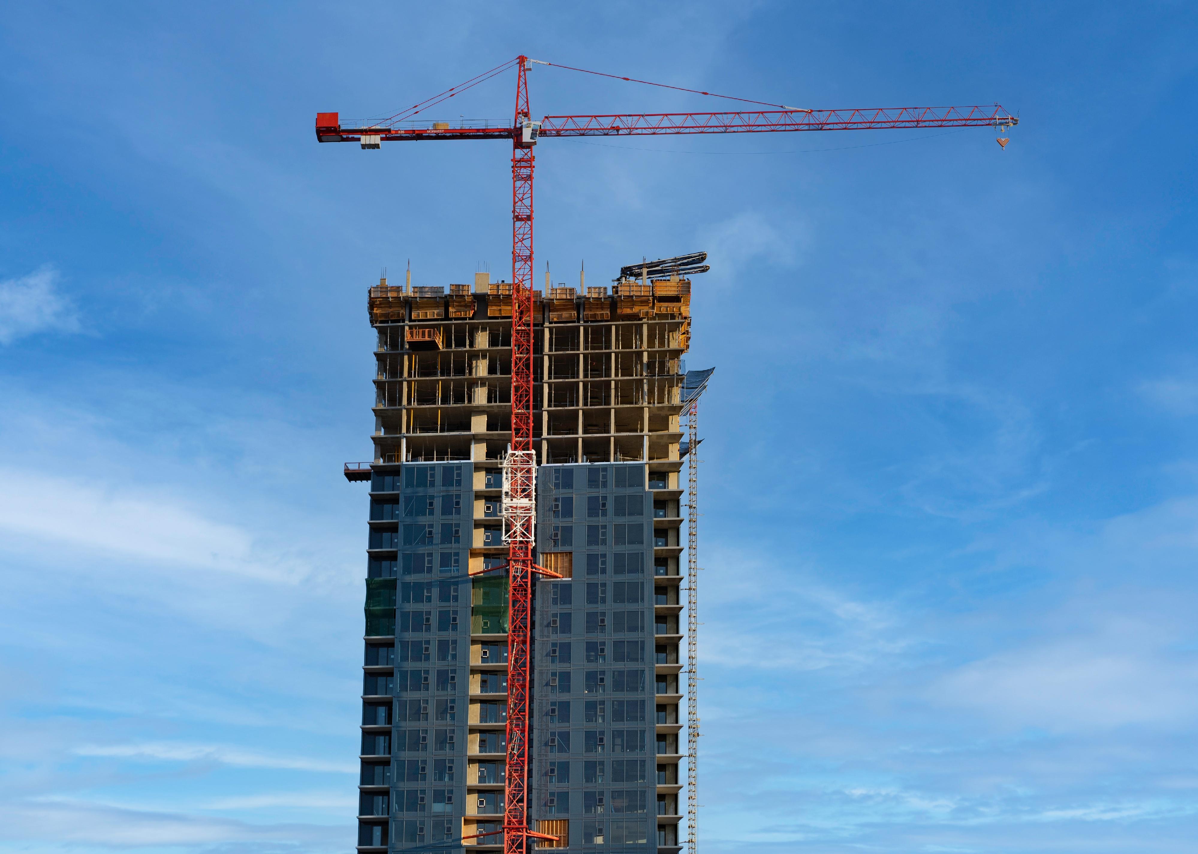 Construction crane on a high-rise apartment building in downtown Calgary.