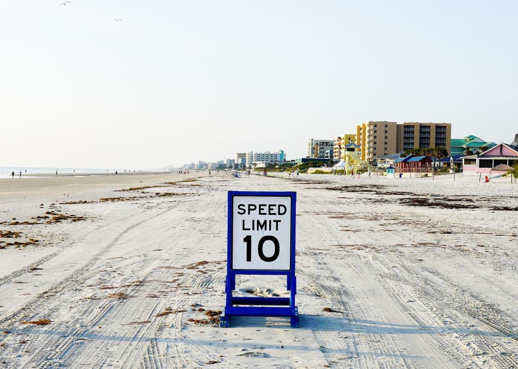 Speed limit sign on beach coast.