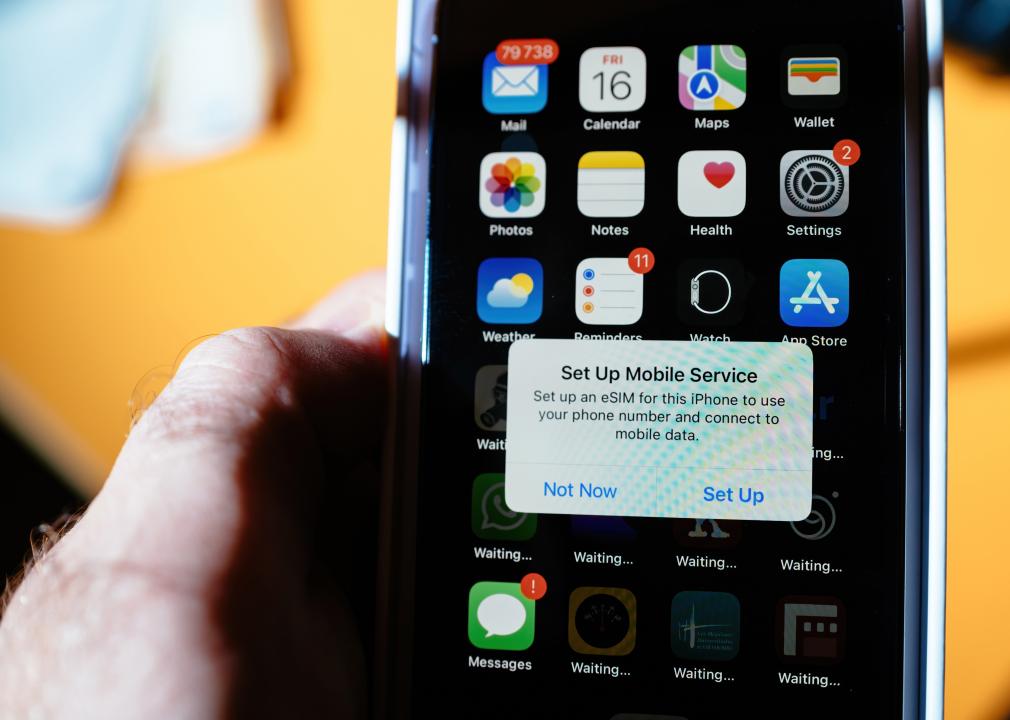 A pop-up message on an iPhone prompting the user to set up mobile service with an eSIM.