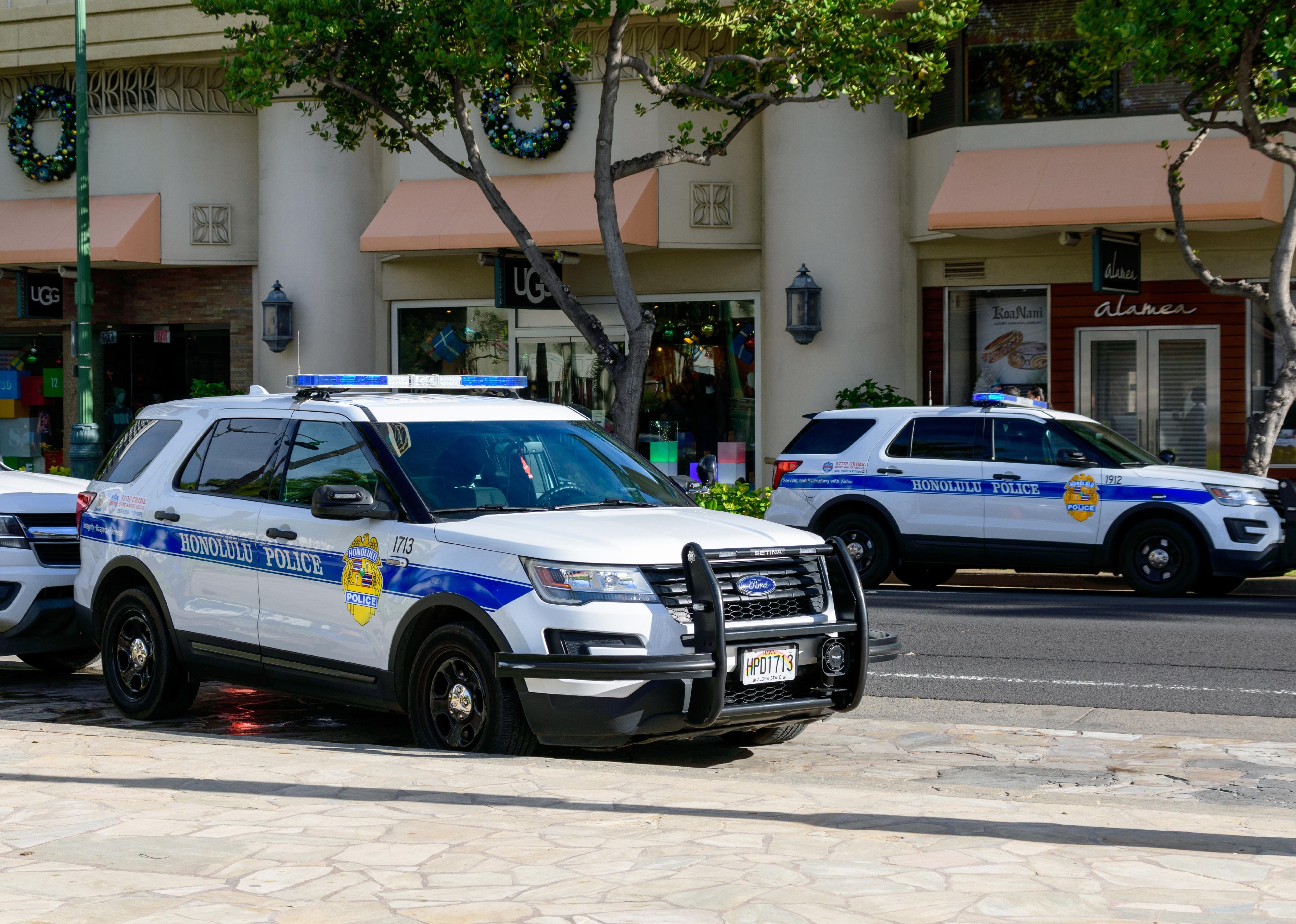 Honolulu Police Department police cars parked in Waikiki neighborhood.