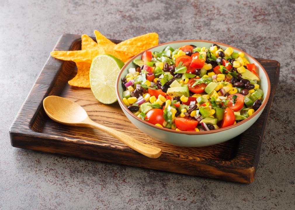 Cowboy caviar  closeup in the bowl on the wooden board.