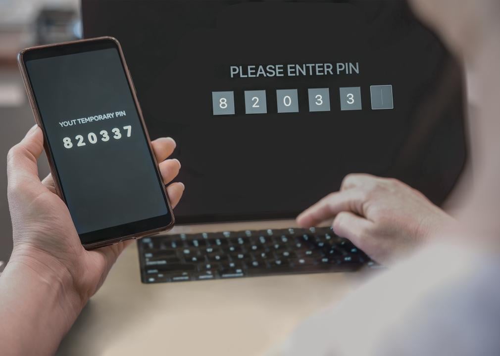 A woman enters a one-time password on a two-step authentication webpage.