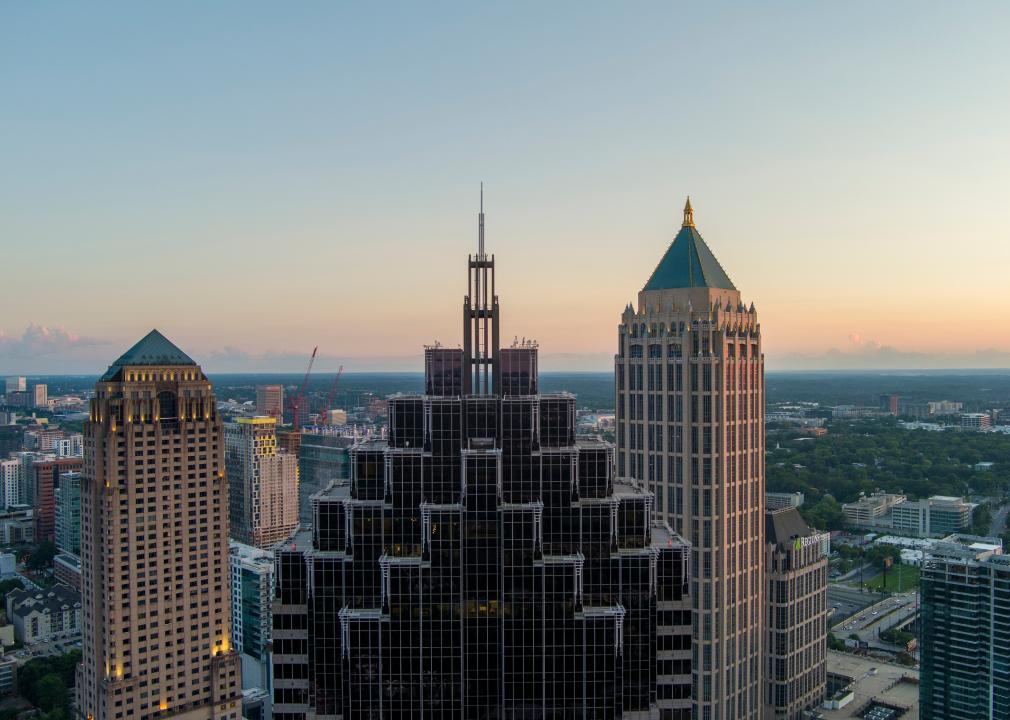 Aerial shot of Truist Plaza, Symphony Tower, and office buildings at sunset in Atlanta.