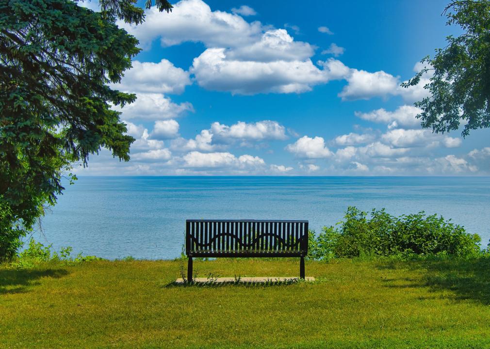 An empty bench faces Lake Michigan.