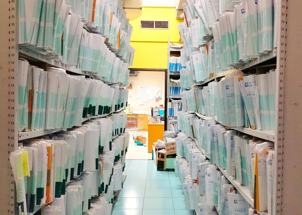 Shelves filled with files of medical records.