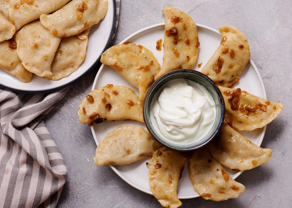 Pierogi with duck with sour cream.