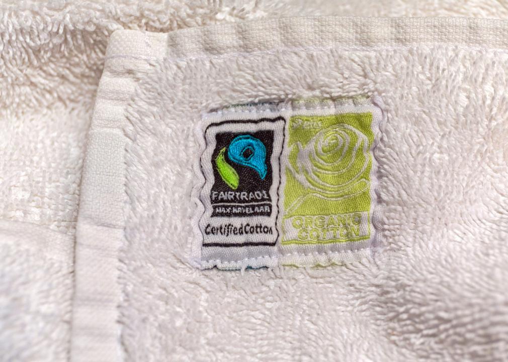 Fair Trade Certified Sign and Organic Cotton badge on a white towel.