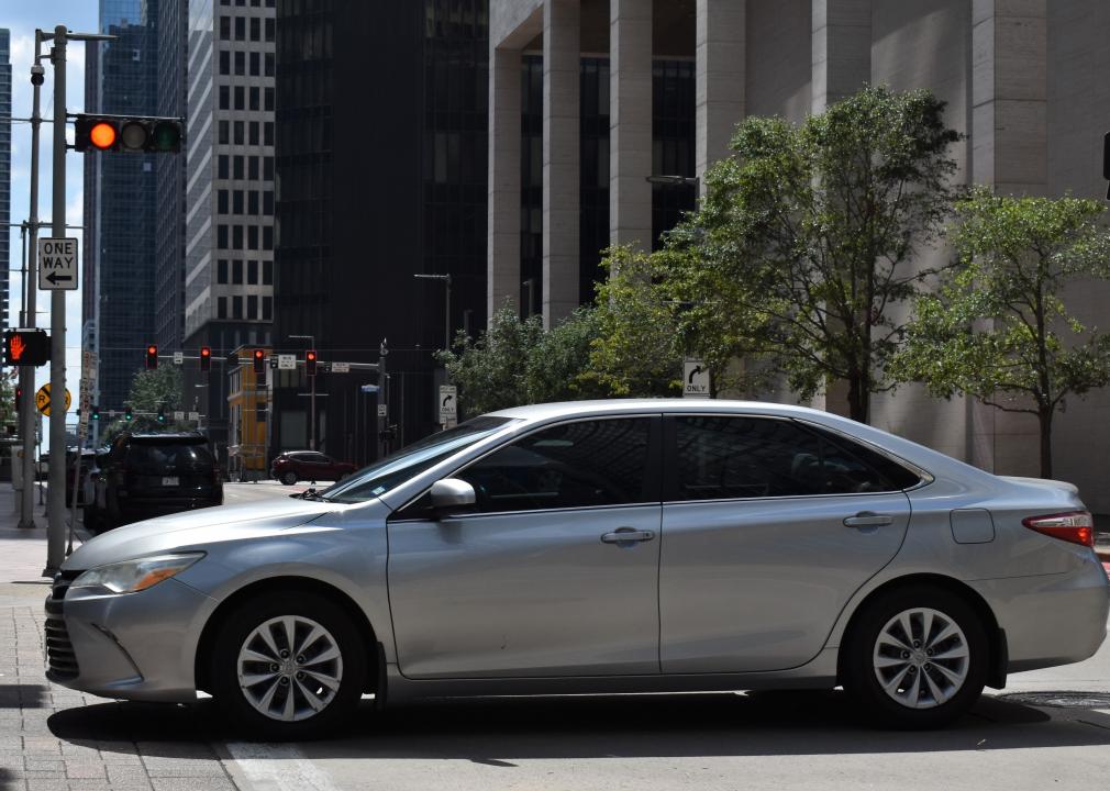  A Toyota Camry Hybrid sedan, in the downtown metropolis of Houston.