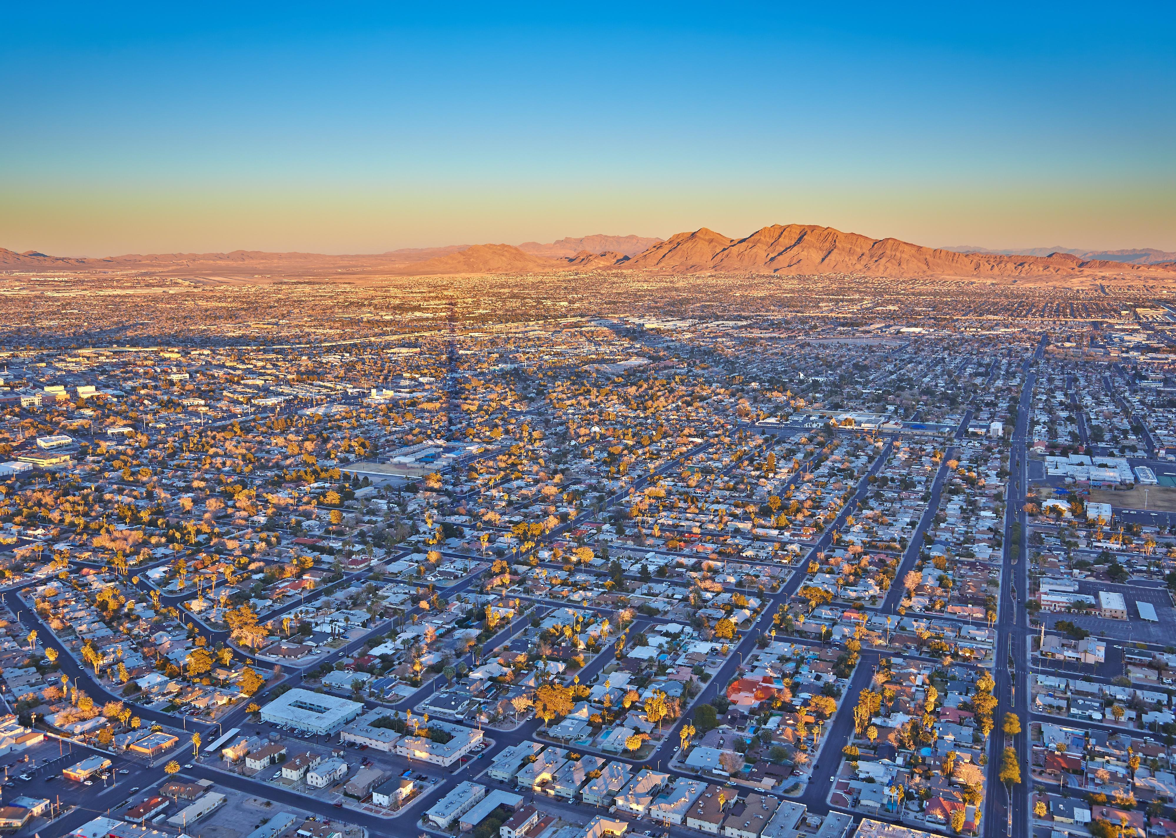Top view of the sunset, mountains and houses in Las Vegas.