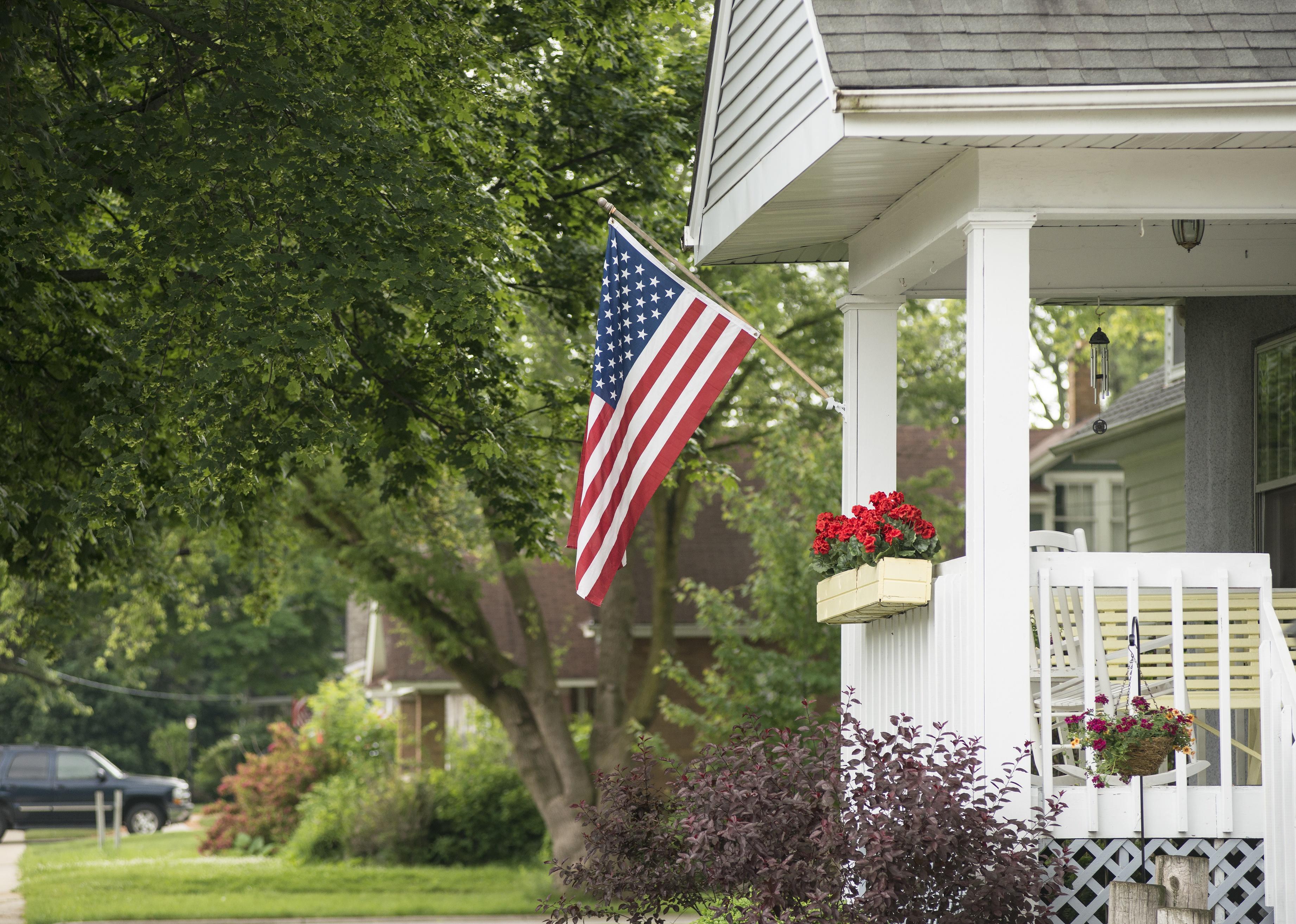 Residential home with an American flag on it