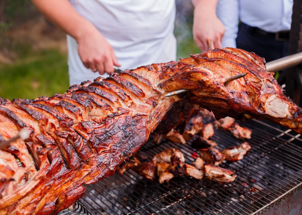 Pig roasting over a grill.