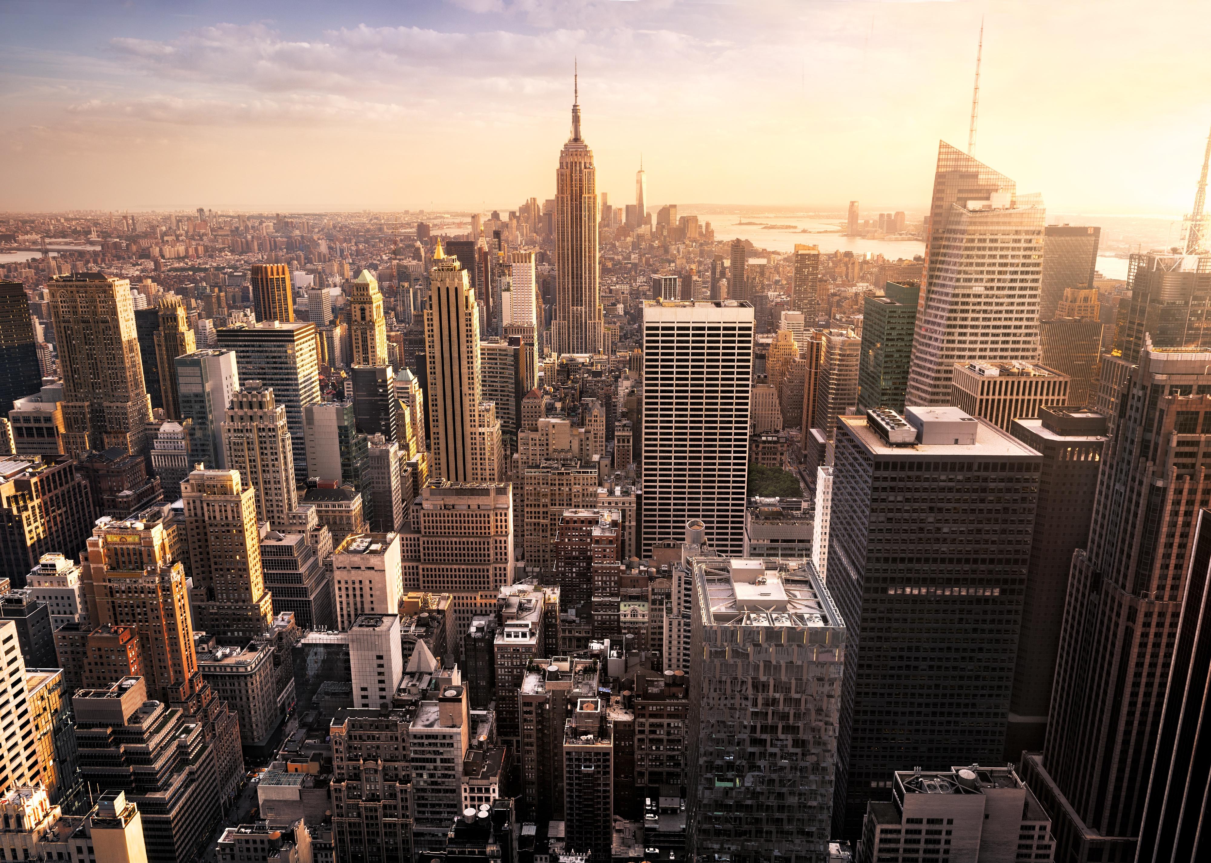 New York City skyline with urban skyscrapers at sunset.