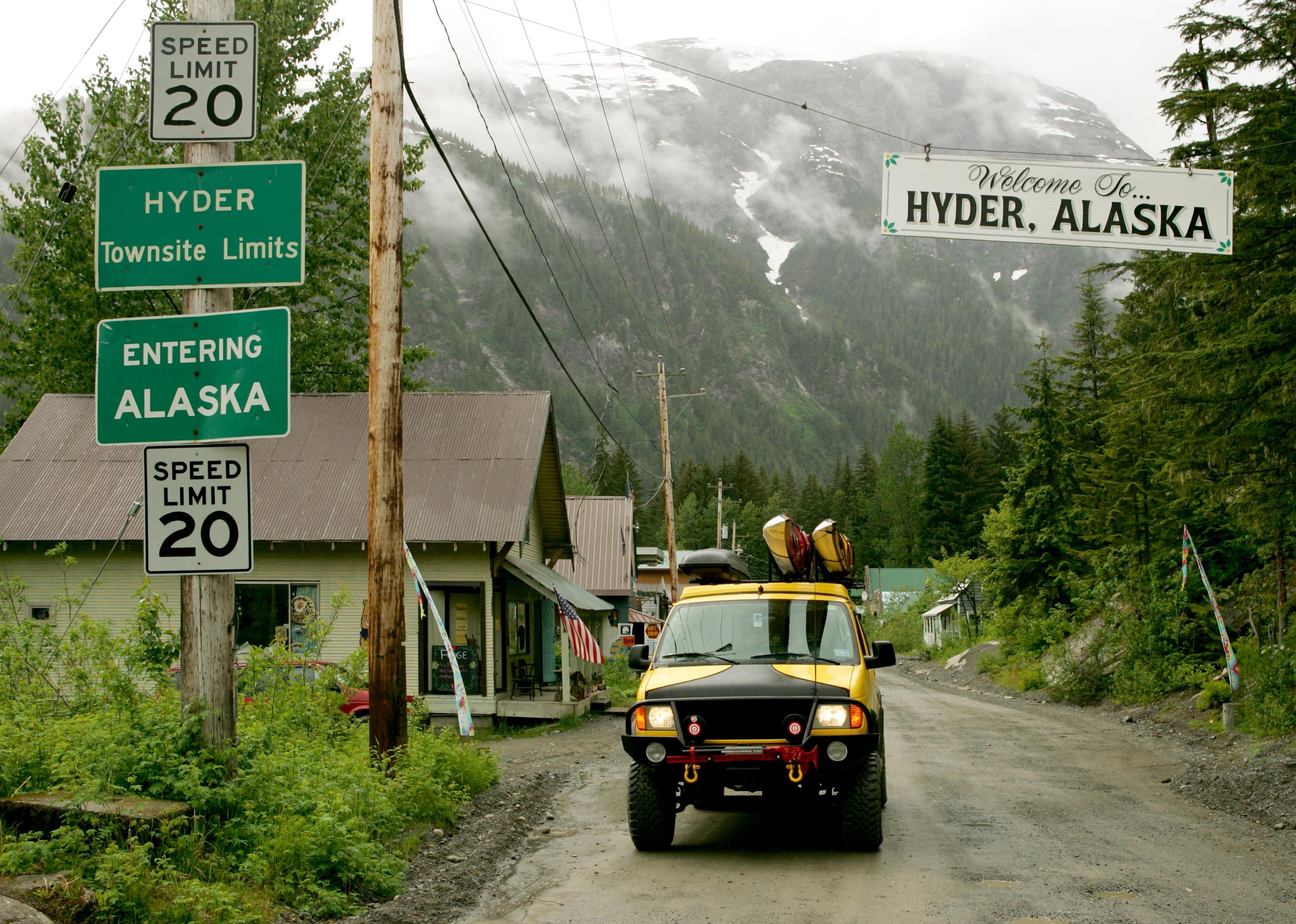 Yellow van on street of Hyder, Alaska.