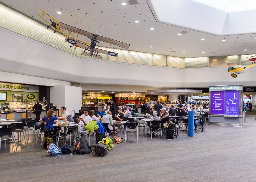 People seated waiting at San Francisco International Airport.