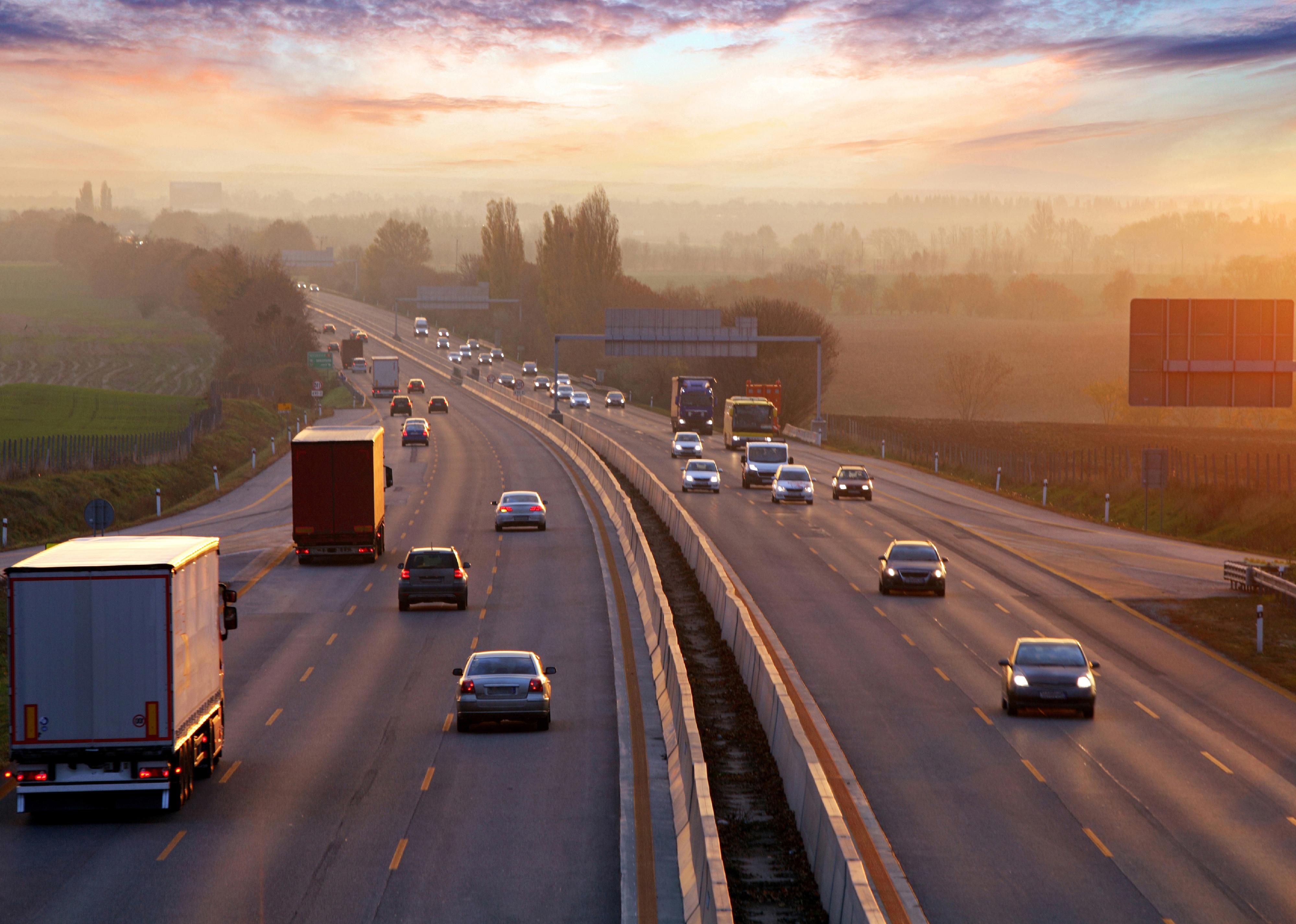 Traffic on highway with cars.