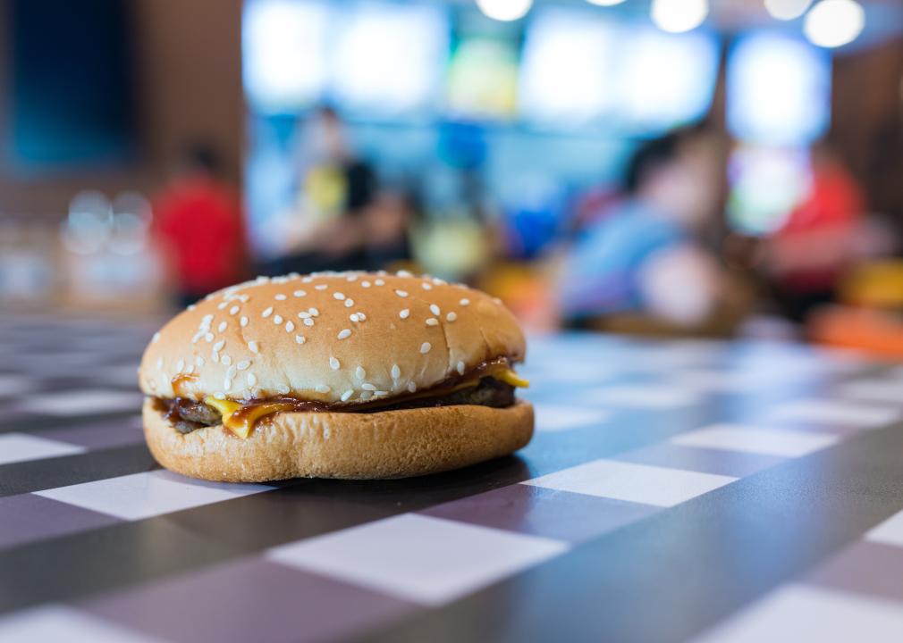 Hamburger on table in fast food shop.